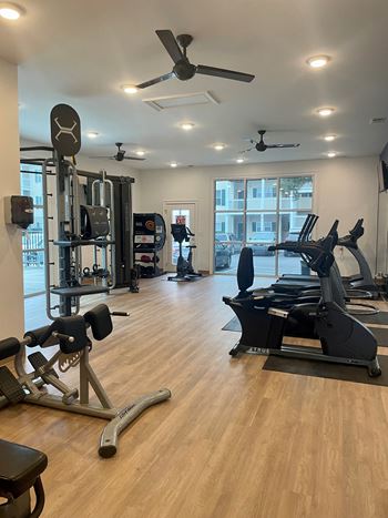 24-Hour fitness center with trx, free weights, and cardio equipment